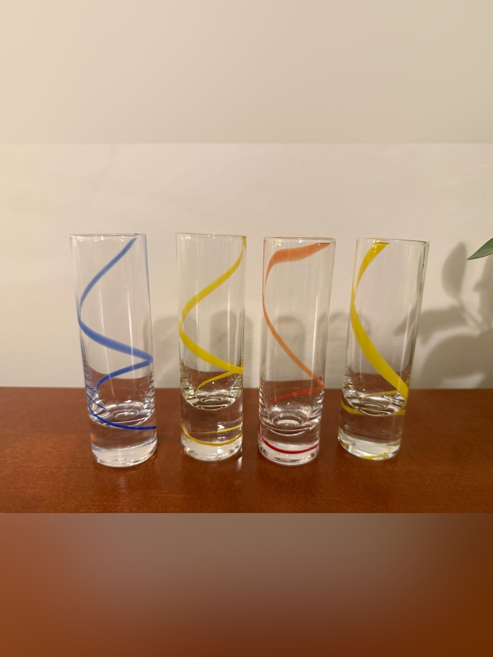 Set of Clear Spiral shot glasses in Yellow and Orange and blue
